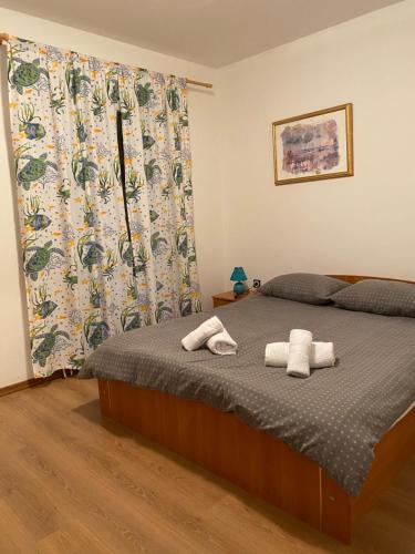 En eller flere senger på et rom på Apartment Boneta