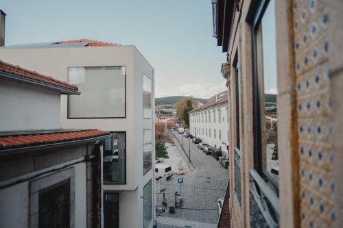 a view of a city street from a building at Alojamento 88 in Castro Daire