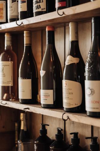 a bunch of bottles of wine sitting on shelves at Inn on the Lake in Broek in Waterland