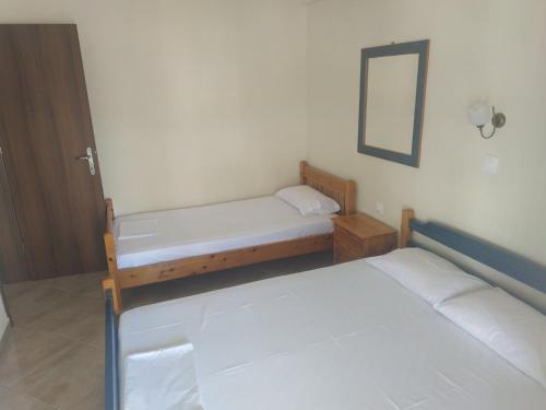 Postel nebo postele na pokoji v ubytování Poly's House