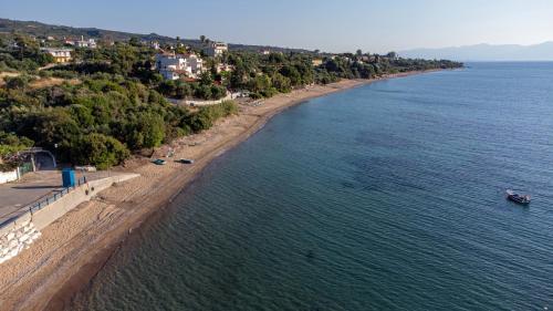 an aerial view of a beach next to the water at 5 meters from the beach in Chrani