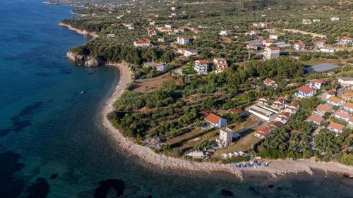 an aerial view of a small island in the ocean at 5 meters from the beach in Chrani