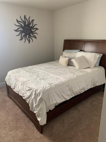 a bedroom with a bed with a spider on the wall at Private, quiet, immaculate bachelor pad with free parking on site in Decatur