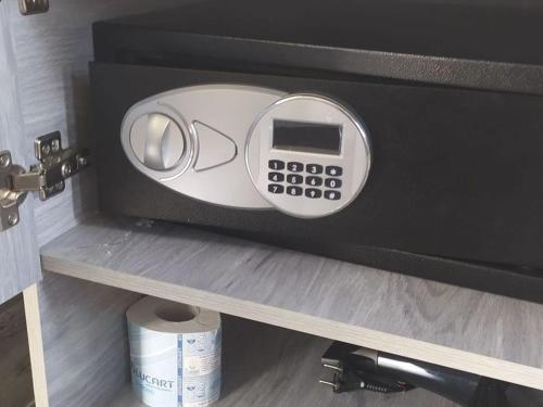 a safe on a shelf in a room at Tropical Suite in Diamante