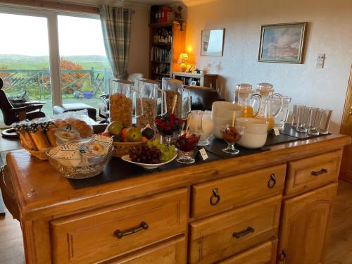 a table with a bunch of food on top of it at Taigh Pa in Uig