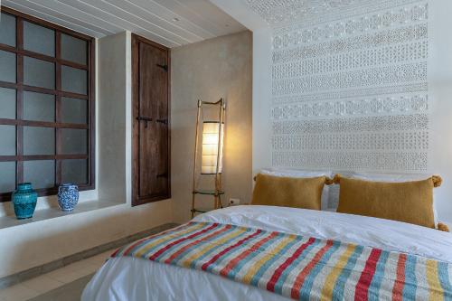 Postel nebo postele na pokoji v ubytování La Villa Joubert