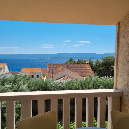 a view of the ocean from a balcony at Villa Mila in Bol