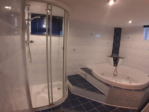 a bathroom with a shower and a sink at Lachtalhütte in Lachtal