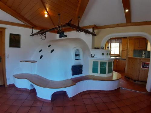 a kitchen with a stove in the middle of a room at Lachtalhütte in Lachtal