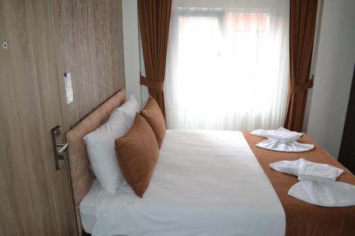 Cama o camas de una habitación en HOTEL GLOBAL 2022