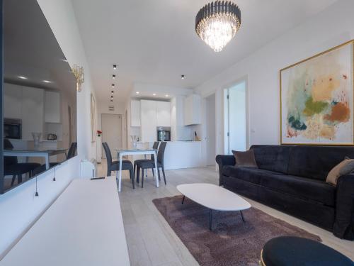 a living room with a couch and a table at Royal Montesun Apartments in Budva