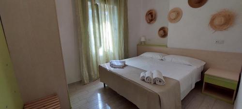 Säng eller sängar i ett rum på Liberato Puglia Vacanze