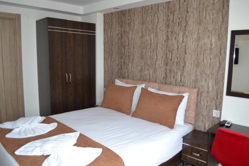 Cama o camas de una habitación en HOTEL GLOBAL 2022