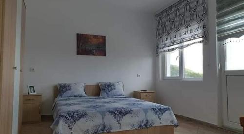 Ένα ή περισσότερα κρεβάτια σε δωμάτιο στο Къщи за гости Евита - град Балчик