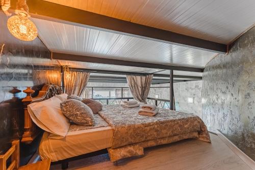 a bedroom with a large bed in a room at BUNGALOW private pool bbq air conditioning stunning ocean view in Adeje