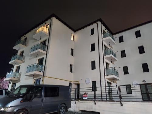 a van parked in front of a building at BYA BROWN in Valea Lupului
