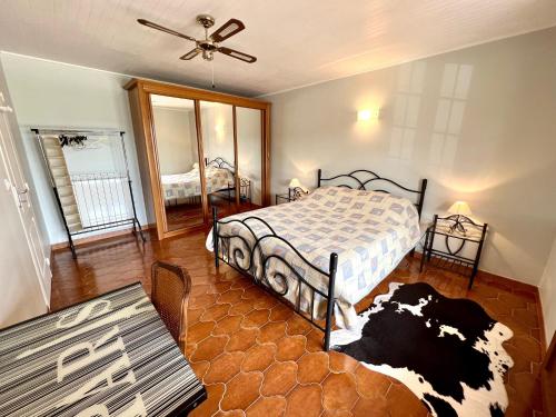 a bedroom with a bed with a cow on it at Villa Chante Grive in Taradeau