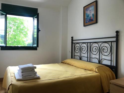 Ένα ή περισσότερα κρεβάτια σε δωμάτιο στο Apartamentos Celorio Playas