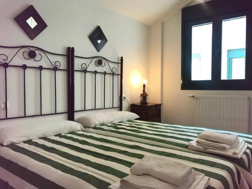 Postel nebo postele na pokoji v ubytování Apartamentos Celorio Playas