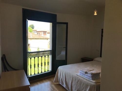 Ένα ή περισσότερα κρεβάτια σε δωμάτιο στο Apartamentos Celorio Playas