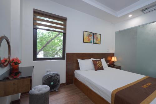 Postel nebo postele na pokoji v ubytování B & B Hotel Quan Hoa