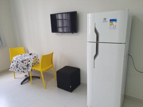 Dapur atau dapur kecil di Pitangueiras Kitnetes