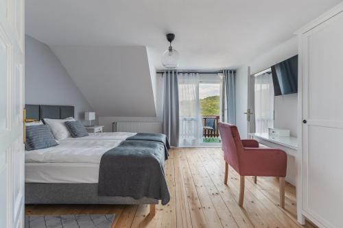 Ένα ή περισσότερα κρεβάτια σε δωμάτιο στο Willa Dobrożyczka