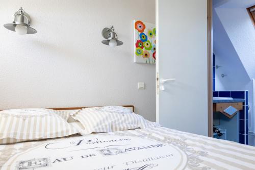 Posteľ alebo postele v izbe v ubytovaní Le Petit Fort - Duplex avec Piscine