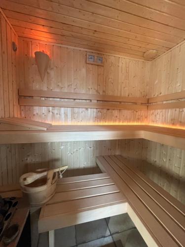 a wooden sauna with a toilet in it at Siedlisko na Górce in Zalec