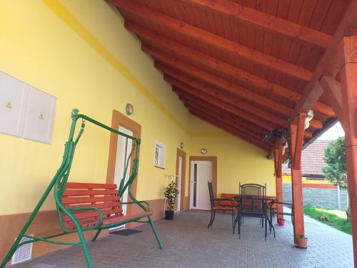 a patio with benches and a table and chairs at Ubytování ve Starém Dvoře in Třemošnice