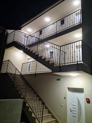 a staircase in a building with metal railings at Appartments Akrapovic in Vrsi
