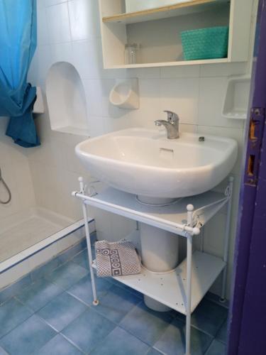 a bathroom with a sink and a toilet at Nefeli Hotel Leros in Agia Marina