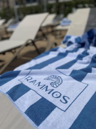 a blue and white towel with the word memories on it at Rammos Managed By Dedeman in Bodrum City