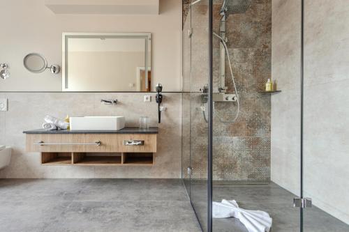 a bathroom with a shower and a sink at Hotel & Restaurant Rödersaal in Großröhrsdorf