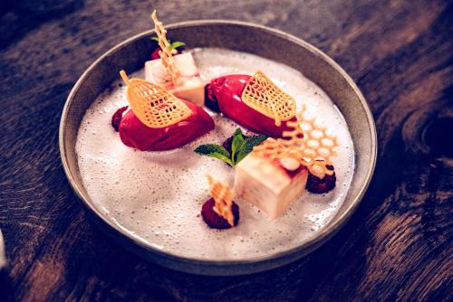 a bowl of food on a wooden table at The Flamingo in Timmendorfer Strand