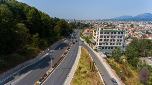 a view of a highway with a city in the background at Hotel Arberia in Tirana