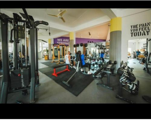 a gym with people working out in the gym at Caesar Resort studio in Iskele