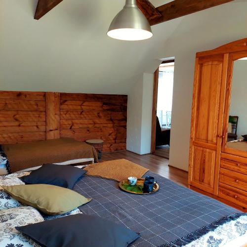 a room with a bed with a tray on it at Zvejnieka ligzda in Ventspils
