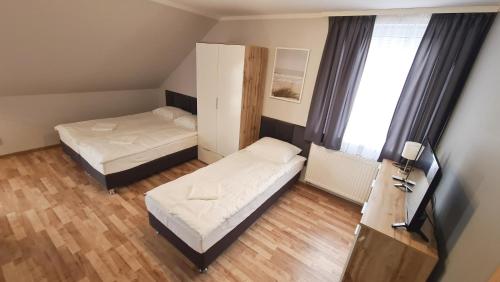 Кровать или кровати в номере Morze u Sary - Wrzosowo 361, Dziwnówek