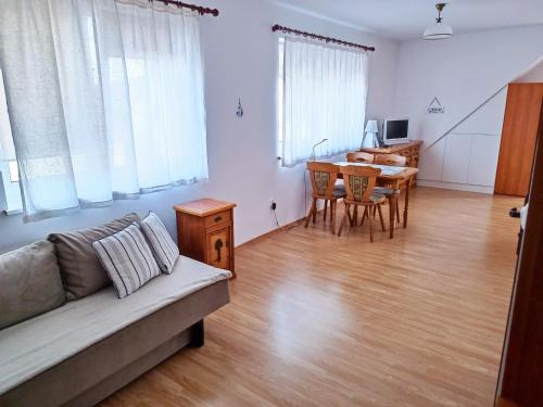 a living room with a couch and a table at Apartament w Świnoujściu in Świnoujście