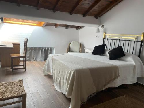 Ένα ή περισσότερα κρεβάτια σε δωμάτιο στο Hotel Casa Beletri