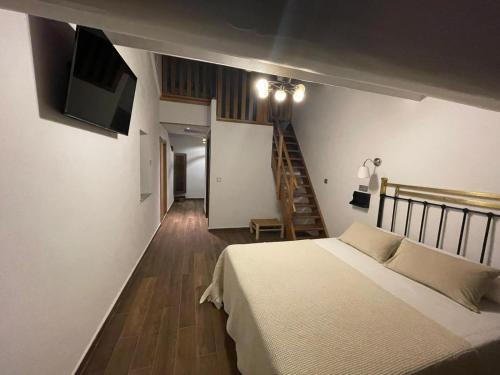 Ένα ή περισσότερα κρεβάτια σε δωμάτιο στο Hotel Casa Beletri