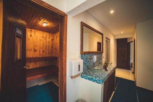 a bathroom with a sink and a mirror at Estancia San Antonio in Guasca