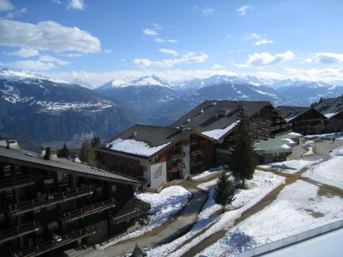 a resort in the mountains with snow on the ground at Apartment in Anzère in Anzère