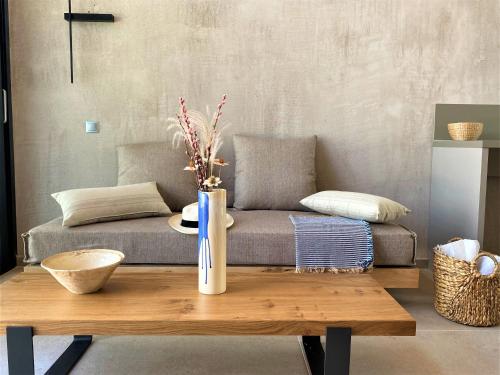 a living room with a couch and a table at Etheres in Nikiti