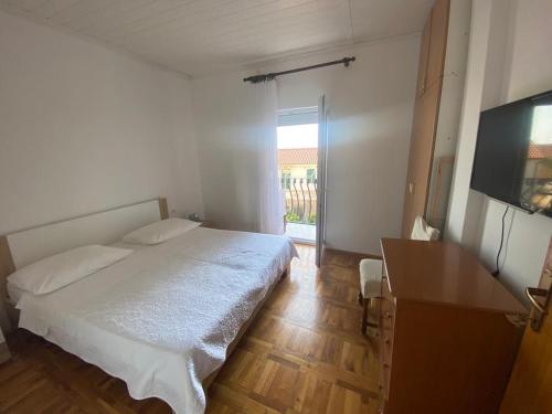 Posteľ alebo postele v izbe v ubytovaní Duje & Roko Apartments
