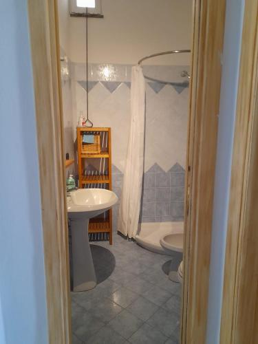 a bathroom with a shower and a sink and a toilet at Casa Mandarino Forio Ischia in Forio d'Ischia