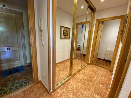 a hallway with a mirror in a room at Circo Bueno in Isla