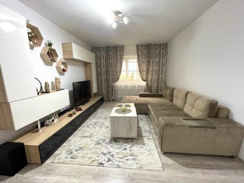 a living room with a couch and a table at Residence RMZ in Mangalia