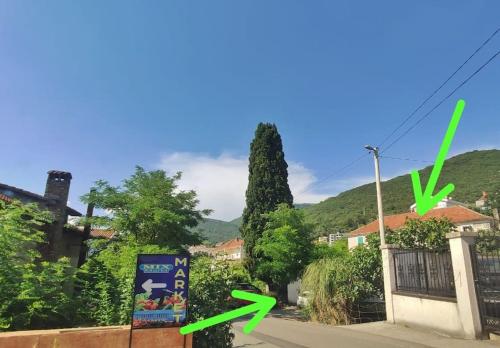 a view of a street with trees and houses at 1-bedroom apartment with 3 beds + private parking in Tivat